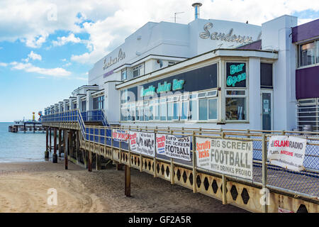 Sandown Pier provides amusements and arcade games on a tourist seaside beach on the Isle of Wight. Stock Photo