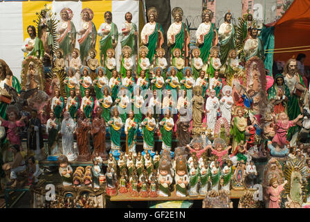 A vendor's booth displaying statues of Saint Jude Thaddeus, in Mexico City on the saint's feast day. Stock Photo