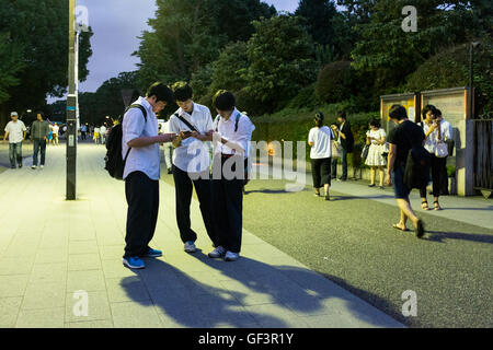 People play Pokemon Go on their smartphones in Ueno Park in Tokyo, Japan Stock Photo