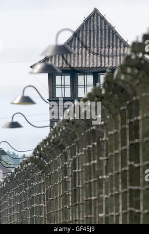 Barbed wire fences and a watchtower are seen on the grounds of the former Nazi extermination camp Auschwitz-Birkenau in Oswiecim, Poland prior to the arrival of Pope Francis on Friday 29 July 2016. The Pope will spend a «Day Of Silence» at the former concentration camp, taking part in the World Youth Day (WYD) held in Poland. Photo: Armin Weigel/dpa Stock Photo