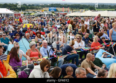 Bolesworth, Cheshire, UK. 29th July 2016. Fans watching Texas performing on the main stage. The event is the brainchild of Chris Evans and features 3 days of cars, music and entertainment with profits being donated to the charity Children in Need. Credit:  Andrew Paterson/Alamy Live News Stock Photo
