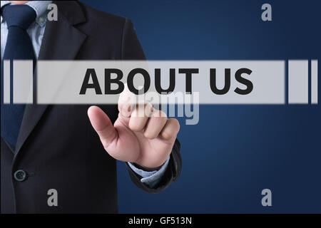 ABOUT US Businessman hands touching on virtual screen and blurred city background Stock Photo