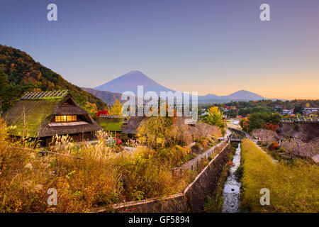 Mt. Fuji, Japan with historic village Iyashi no Sato during autumn. Stock Photo