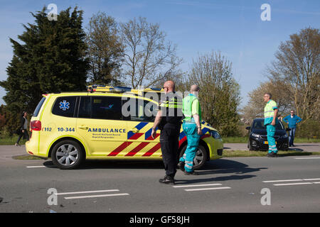 Bovenkarspel, the netherlands - may 5-2016: Emergency services attending to a crash between two passenger cars, Stock Photo