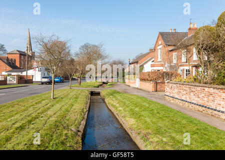 Old cottages next to Sheepwash Brook in the village of East Leake, Nottinghamshire, England, UK Stock Photo