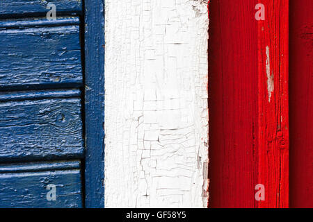 Abstract colorful fragment of rural wooden wall in classical Scandinavian style with blue white red areas. French flag color sch Stock Photo