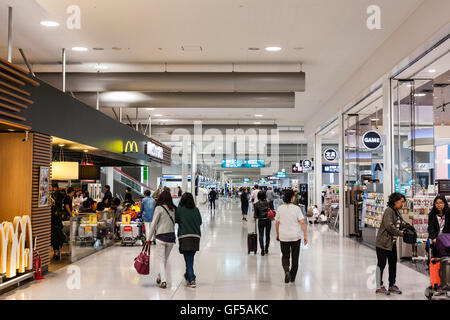 Japan, Osaka, Kansai airport, KIX. Interior of terminal one. Domestic check-in hall 2nd floor. McDonalds fast food restaurant and concourse with peopl Stock Photo