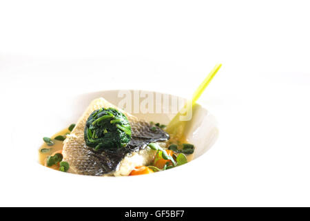 Sea bass with spinach Stock Photo