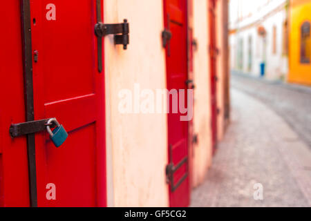 Red wooden door with lock Stock Photo