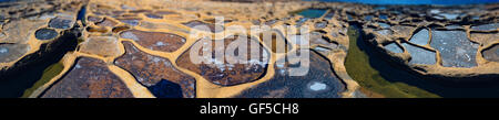 Man made evaporation ponds for salt production, Malta Stock Photo