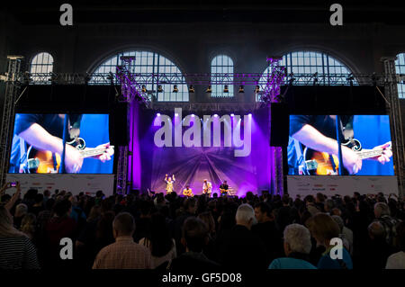 Swiss folk rock group 77 Bombay Street performing at a concert. Stock Photo
