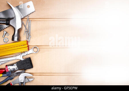 Assorted work tools on wood. Copy space Stock Photo
