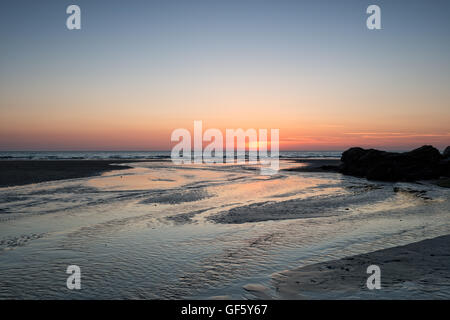 Beautiful sunset over the beach at Perranporth in Cornwall Stock Photo