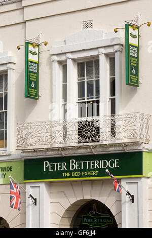 UK, England, Devon, Honiton, High Street, Peter Betteridge bed shop in 1820 former Pannier Market building Stock Photo
