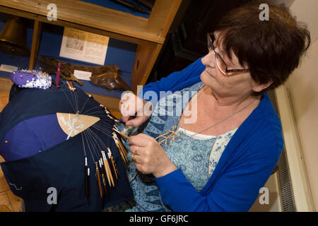 UK, England, Devon, Honiton, High Street, Allhallows Museum, Madeleine Wilkes demonstrating lace making Stock Photo