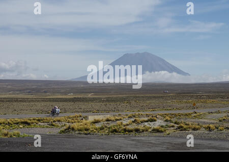 View of volcano near Arequipa from viewpoint in altitude 4910 meters. Highway in Andes mountains plateau, Peru Stock Photo