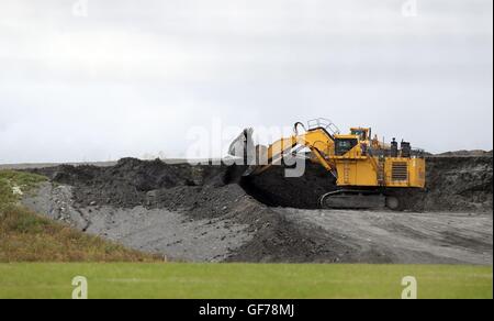 Diggers near to the proposed site of Hinkley Point C nuclear power station in Somerset, as energy giant EDF is set to make its long-awaited final investment decision on the planned station, ending doubts over the massive &pound;18 billion project. Stock Photo