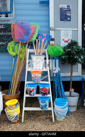 fishing nets and buckets on display outside shop Stock Photo