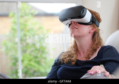 virtual reality headset worn by female person Stock Photo