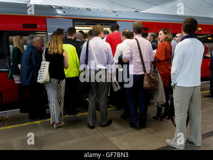 Commuters waiting to board a train at Blackfriars station, London, during the evening rush hour, as Department for Transport figures show that the station has the highest percentage of passengers above the official capacity for their service out of all major stations in the capital at 14% in the morning peak. Stock Photo