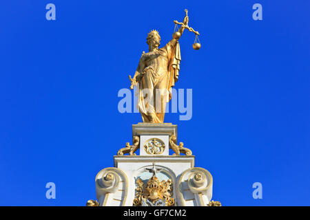 Close-up of a blindfolded Lady Justice (Justitia) on top of the Old Civil Registry (1534-1537) in Bruges, Belgium Stock Photo