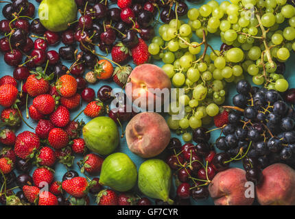 Healthy summer fruit variety. Black and green grapes, strawberries, figs, sweet cherries, peaches