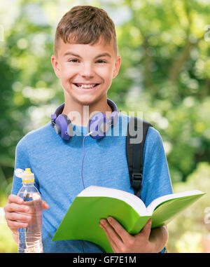 Teenager boy drinking bottle water, hot summer day Stock Photo by  ©Valerii_Honcharuk 321340528