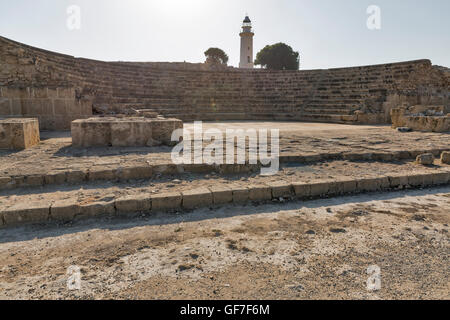 Ancient amphitheatre and old lighthouse in Paphos, Cyprus. Archaeological site of Kato Paphos. Stock Photo