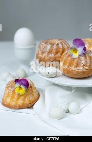 Easter cakes, pansies and eggs Stock Photo