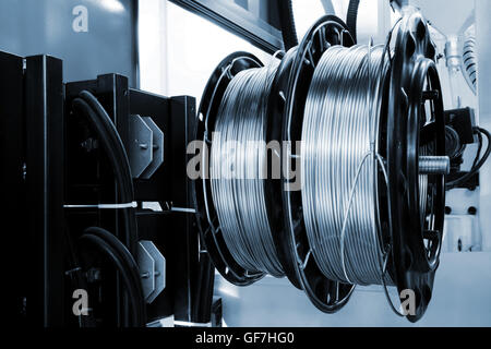 shiny copper wire on spools in the shop Stock Photo