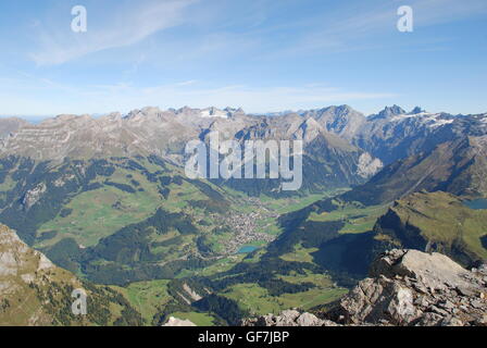Panoramic view, panorama, Swiss alps, green, mountain range, clouds, blue sky, peaks, meadows, vista, view, village, lake Stock Photo
