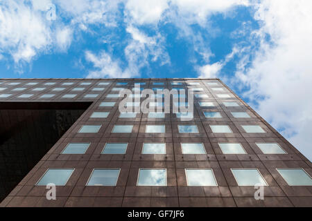 Modern architecture with clouds reflexions on square windows in London Stock Photo