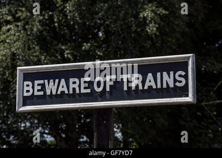 Beware of Trains sign at the Didcot Railway Centre in Oxfordshire England Stock Photo