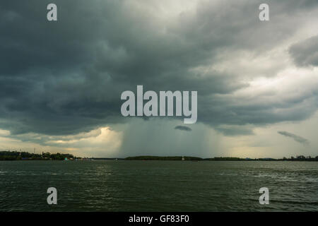 Raining with cloudy stormy black and white dramatic sky on background Stock Photo
