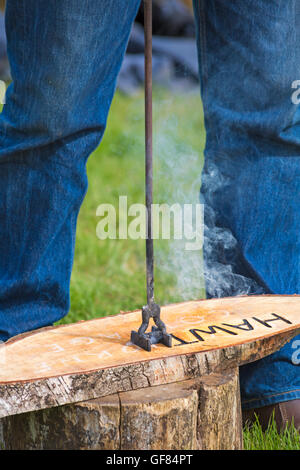 Hot branding a name plate at New Forest & Hampshire County Show, Brockenhurst in July Stock Photo