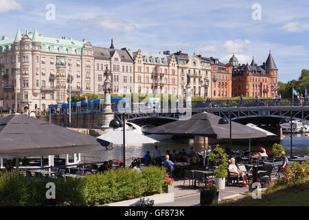 Stockholm, Sweden - Jul 27, 2016 : View of Stockholm djurgarden bridge, waterfront park and cafe in summer. Stock Photo