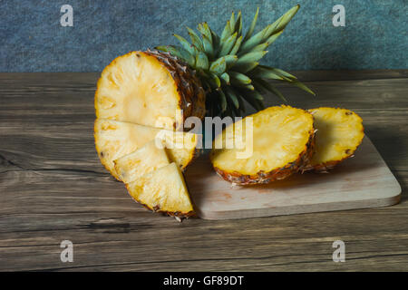 pineapple on the wood texture background Stock Photo