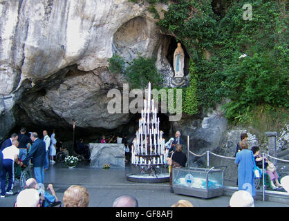 Statue of the Virgin Mary at the holy grotto at Lourdes The French town, set in the Pyrenees, has been a sacred place since 1858 Stock Photo