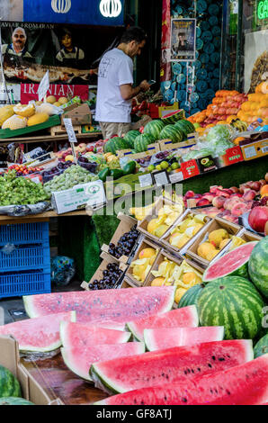 Fresh fruit and vegetables on display outside a shop on Kensington High Street, London. Stock Photo