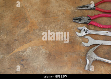 different tools on rustic wooden worktop, copy space background Stock Photo