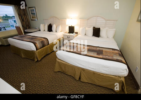 Two double size beds in a hotel room Stock Photo