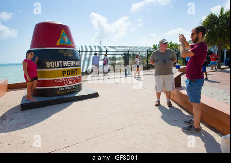 KEY WEST, FLORIDA, USA - MAY 02, 2016: Tourists are making pictures at the southernmost point of the USA in Key West in Florida Stock Photo