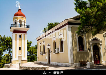 Ornate Bell Tower and a Church on a Hill – Poros, Kefalonia, Greece. Stock Photo