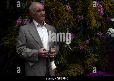 A Gastorenian Pipe player poses in a street decorated with flowers during Corpus Christi religious celebration in El Gastor, Sie Stock Photo