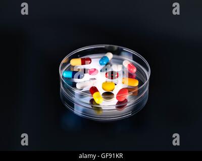 A variety of pills in a petri dish. Stock Photo