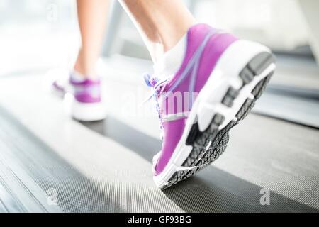 PROPERTY RELEASED. Sole of trainer on treadmill, close-up. Stock Photo
