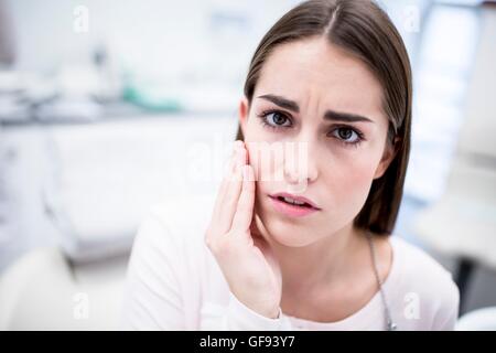 MODEL RELEASED. Young woman suffering from toothache, portrait. Stock Photo