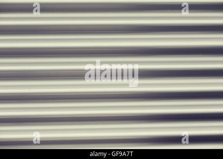 close up of aluminum metal garage door backdrop Stock Photo