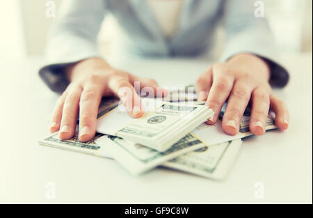 close up of woman hands counting us dollar money Stock Photo