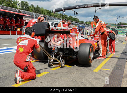 Hockenheim, Germany. 30th July, 2016. Finnish Formula 1 racer Kimi Raikkonen from Scuderia Ferrari arrives to the box during the 3rd open training on the Hockenheimring in Hockenheim, Germany, 30 July 2016. The German Grand Prix takes place on 31 July 2016. Photo: WOLFRAM KASTL/dpa/Alamy Live News Stock Photo